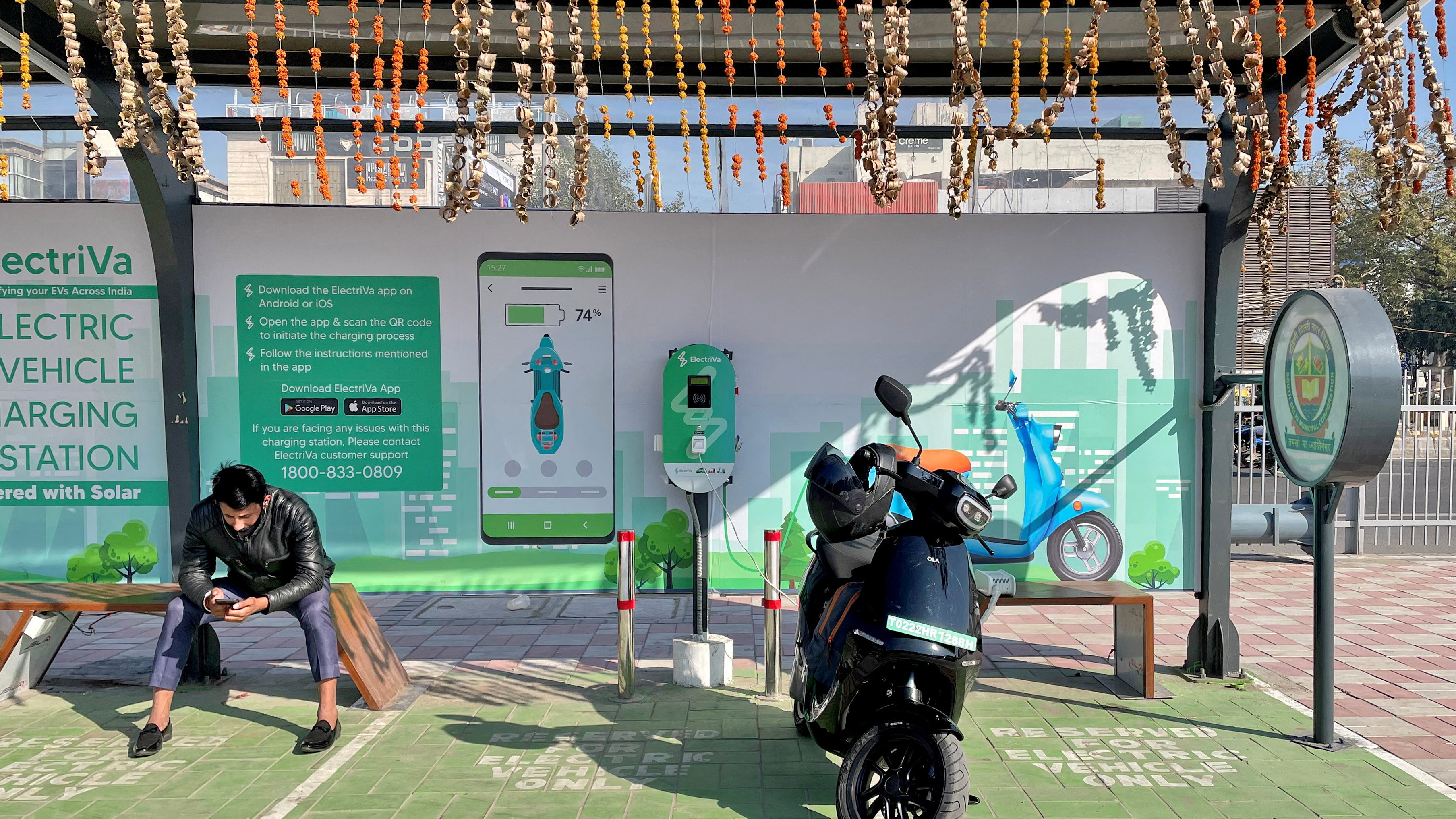 Ola electric scooter charging at a station in New Delhi, India. 

Image Source: Reuters 