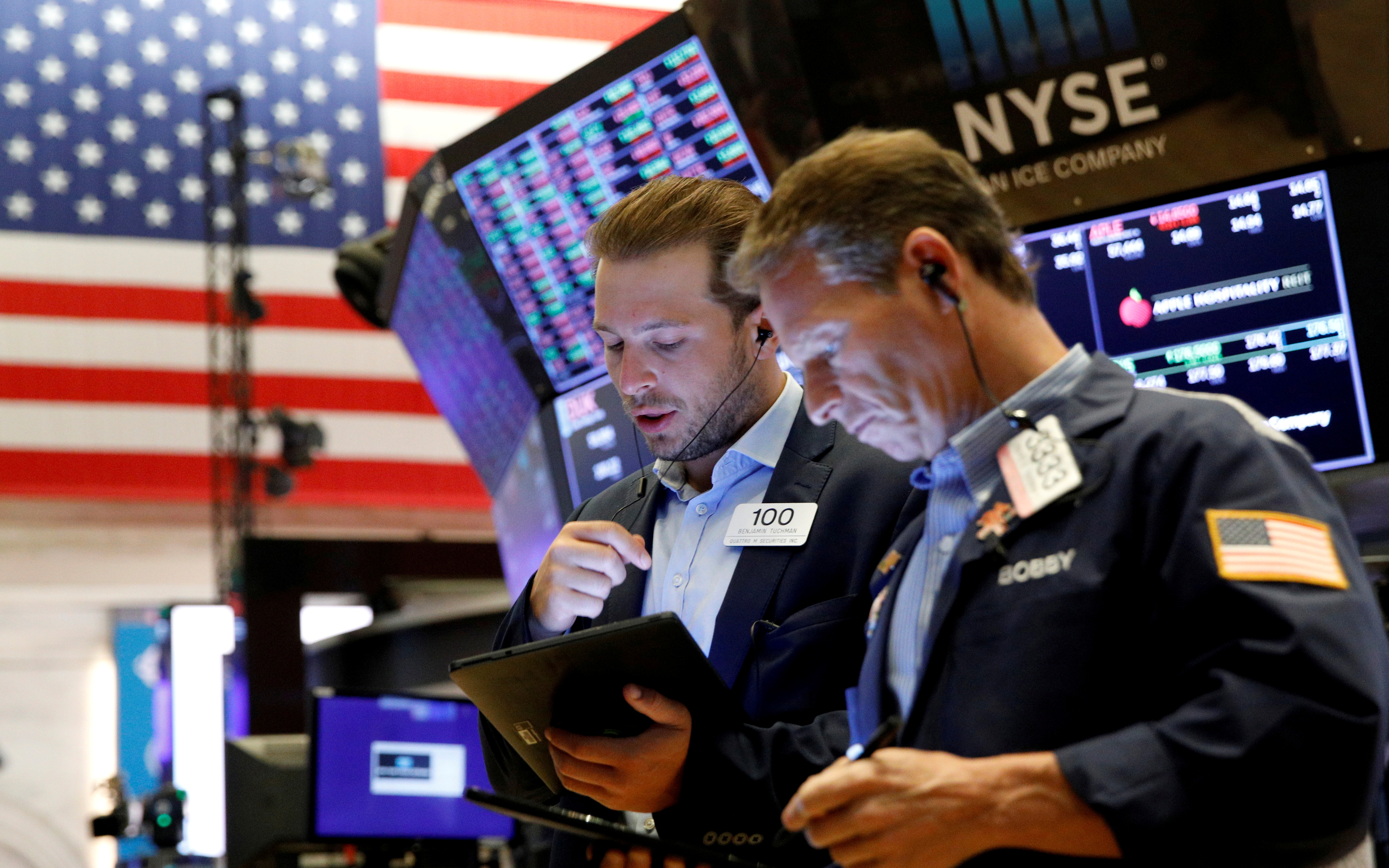 Traders actively working on the floor at the New York Stock Exchange (NYSE) in New York City. 

Image Source: Reuters 